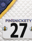 pinsnickety purple poppy horse show number pin on a bonnet and queen bee equestrian pins on a saddle pad