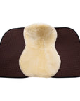 Brown saddle pad with a beige sheepskin cover on a white background