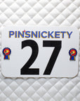 pinsnickety champion horse show number pins on a saddle pad