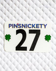 Pinsnickety Clover horse show number pins on a saddle pad