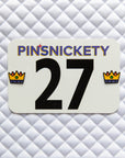 Pinsnickety Crown horse show number pins on a saddle pad
