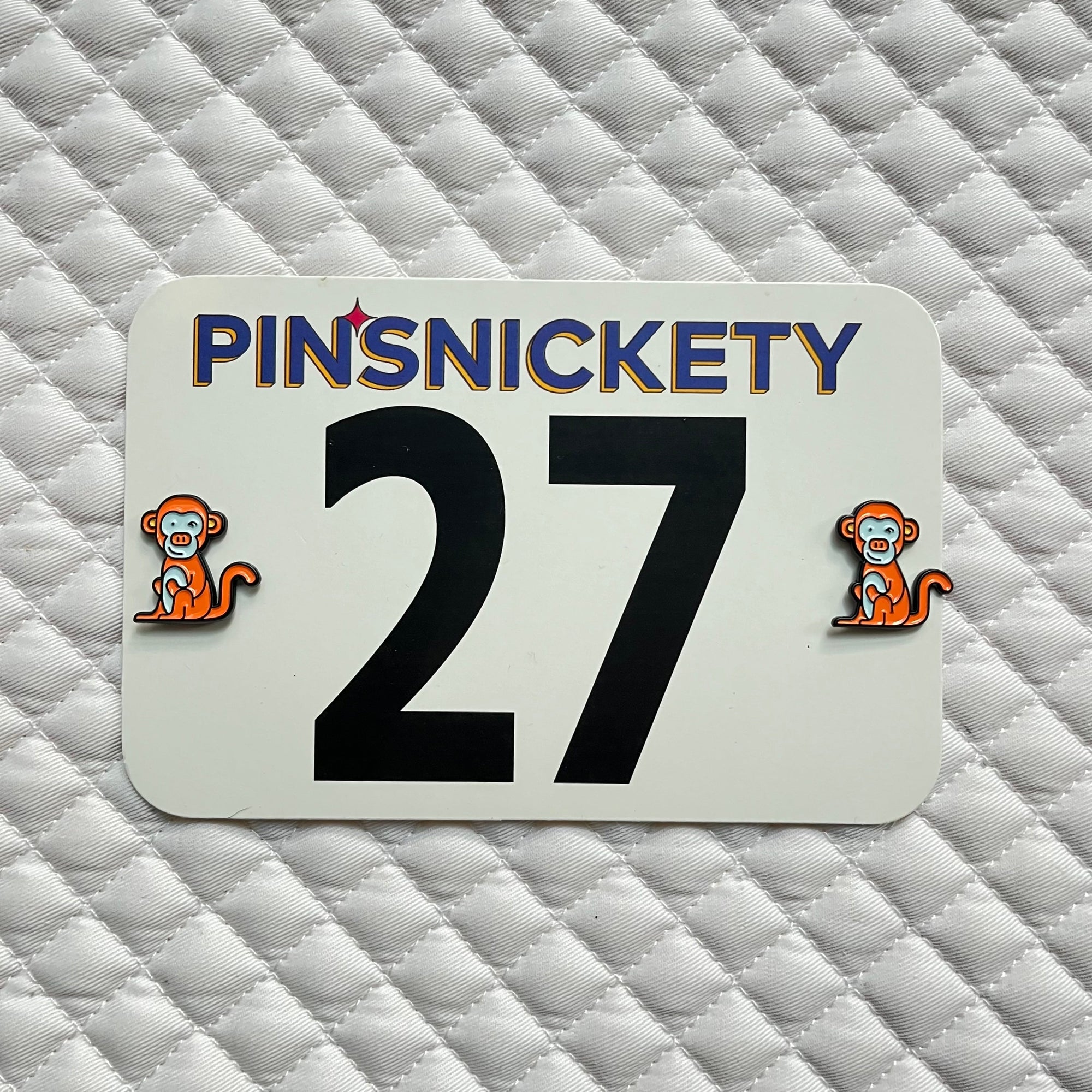 pinsnickety monkey horse show number pins on a saddle pad
