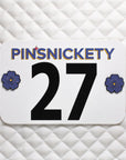 pinsnickety purple poppy horse show number pins on a saddle pad