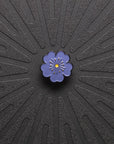 pinsnickety purple poppy horse show number pin on a black background