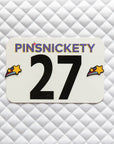 Pinsnickety Shooting Star horse show number pins on a saddle pad