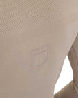 Close-up of the Equestro training shirt knit texture with embossed tonal Equestro shield emblem