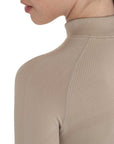 Shoulder detail of the Equestro training shirt showing seamless raglan construction and ventilated knit panel