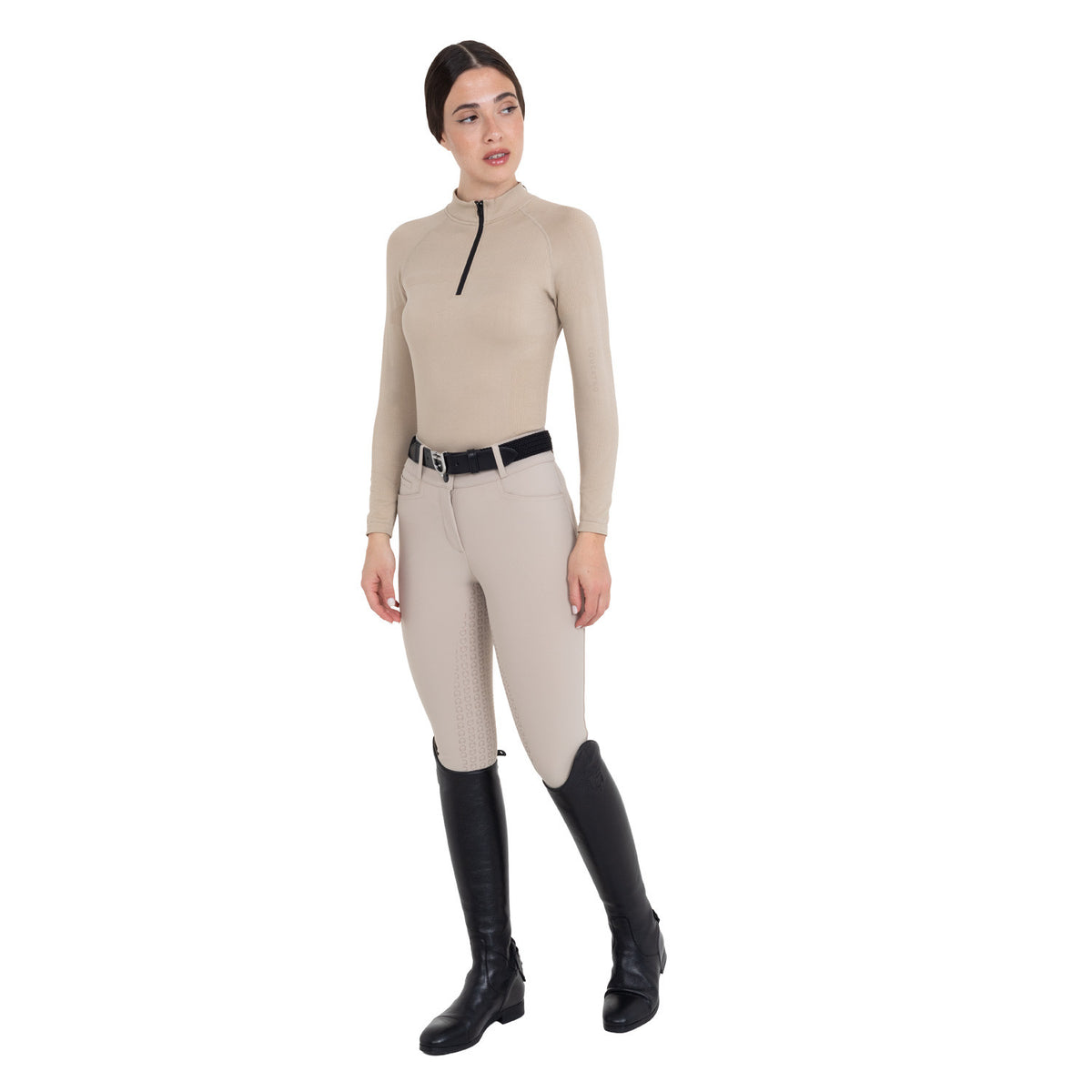 Rider wearing the Equestro Cobblestone technical knit training shirt with matching breeches and black tall boots