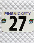 Pinsnickety Dumpster Fire horse show number pins on a saddle pad