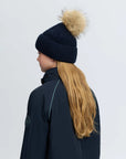 LeMieux Clara Rib Beanie in Navy, back view showing ribbed knit construction and faux fur pom