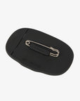 LeMieux silicone saddle pad number holder in black, back view showing the stainless steel safety pin