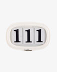 LeMieux silicone saddle pad number holder in white, front view with three number cards fitted