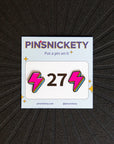 Pinsnickety Lightning Bolt horse show number pins on a saddle pad.