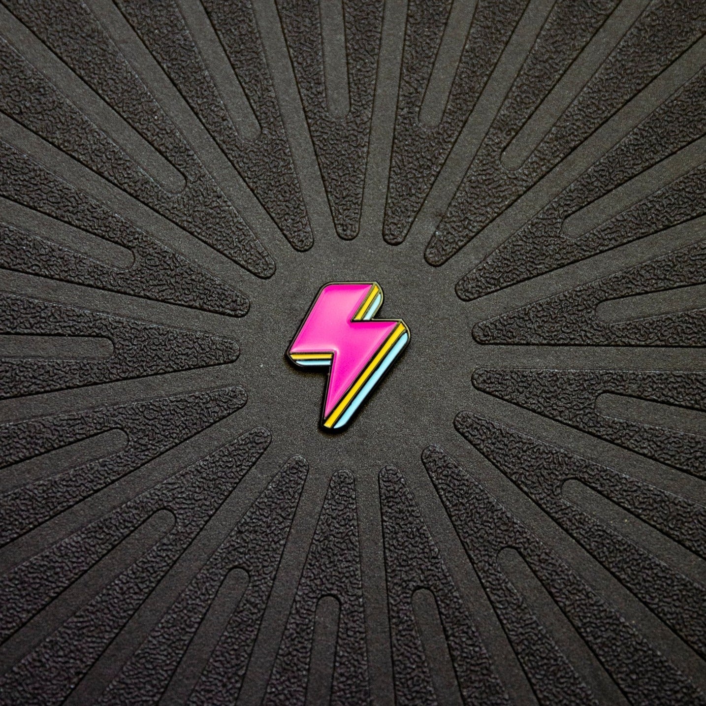Close up view of Pinsnickety&#39;s Lightning Bolt horse show number pin