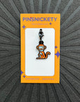 pinsnickety monkey bridle charm on a black background