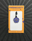 pinsnickety purple poppy bridle charm on a black background